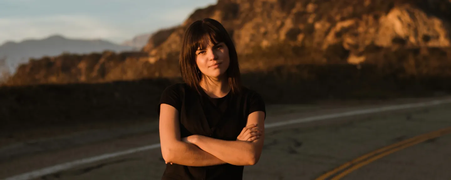 Julia with her arms crossed