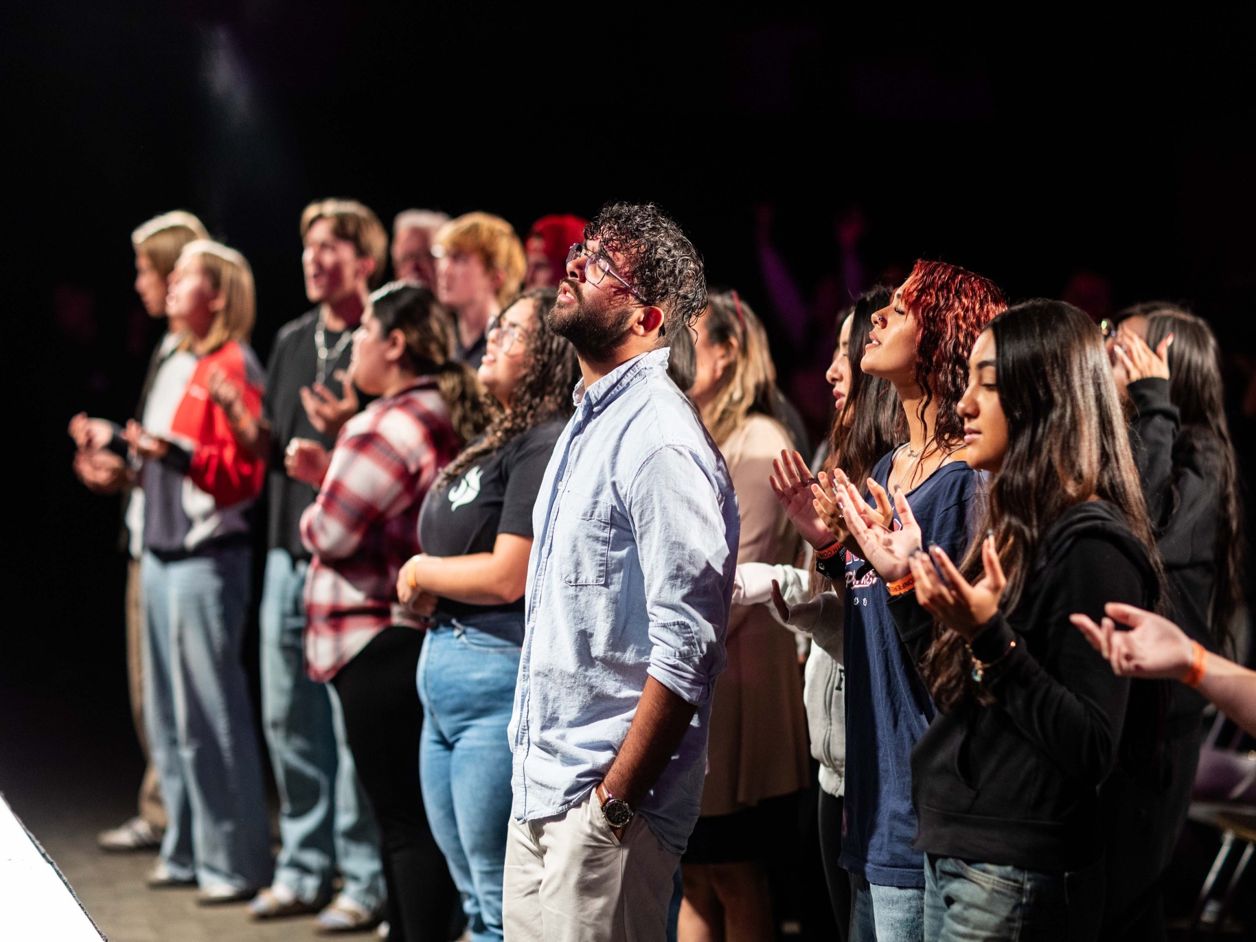 People singing and worshiping together.