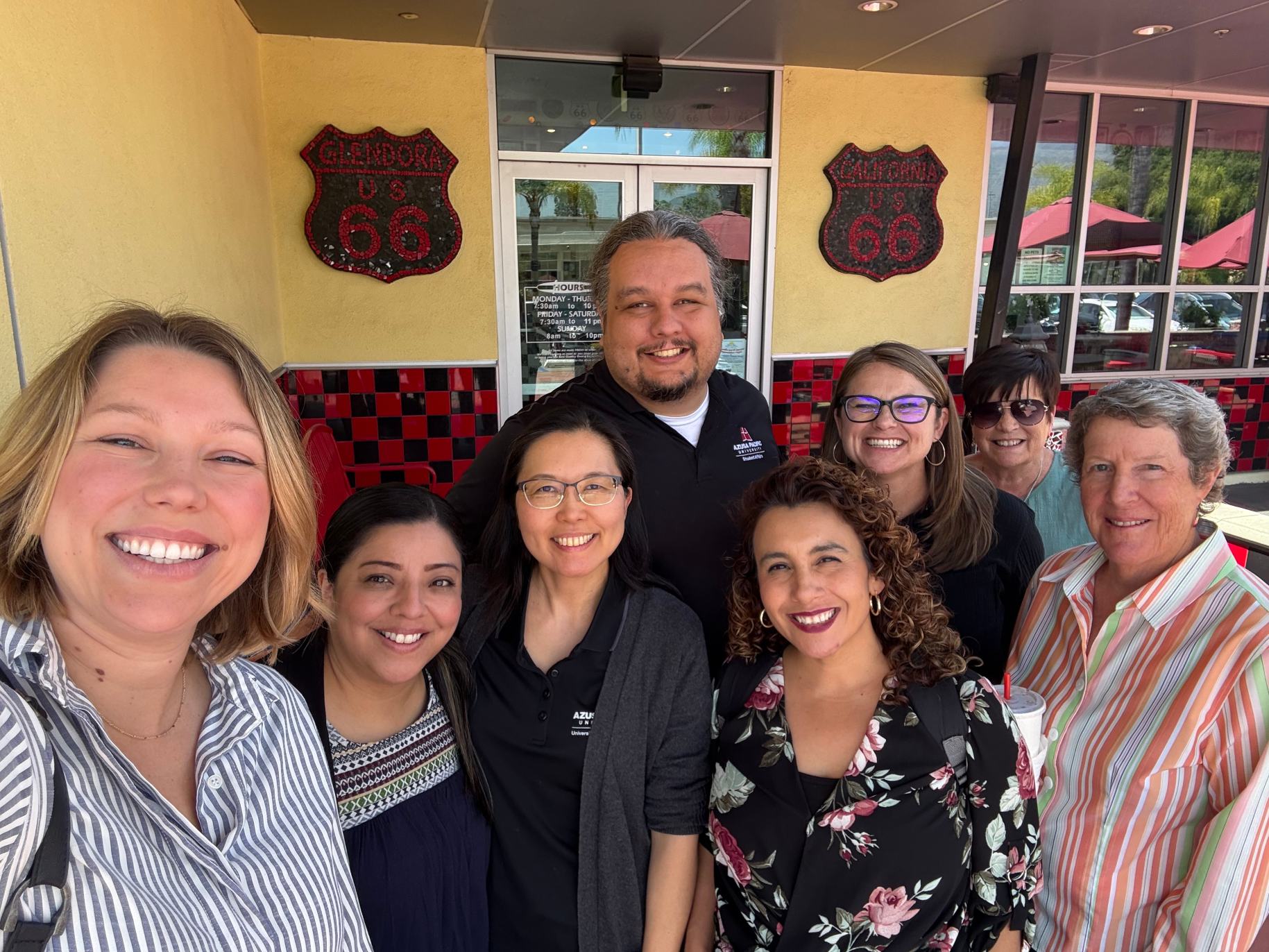 The UCC team stands together for a selfie.