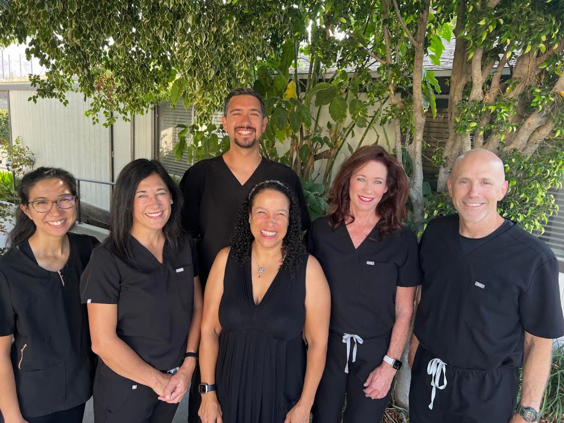 The Student Health Center team stands together in their scrubs.