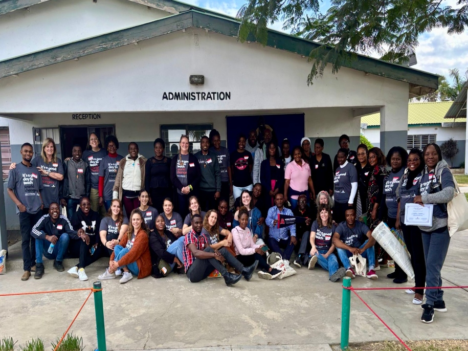 Zambian teachers and APU teacher candidates gather outside for a picture.