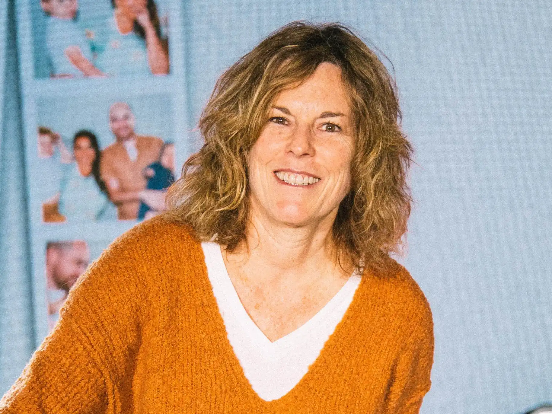 Cheryl Fletcher smiling for a picture on stage.