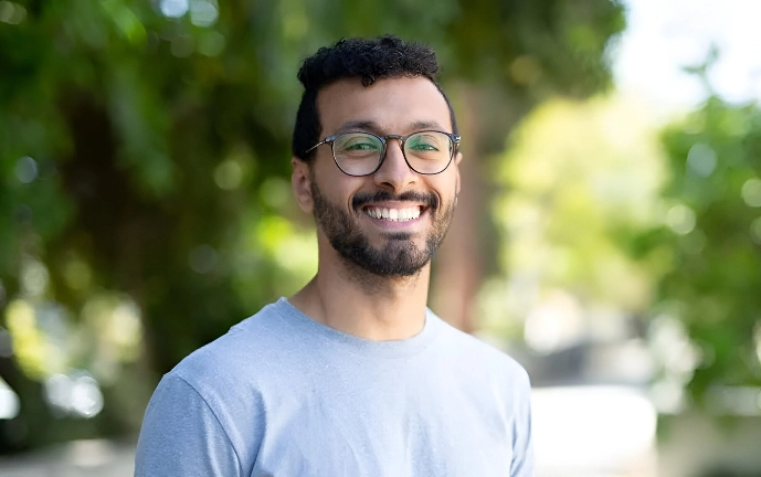 mark wearing blue t-shirt and smiling