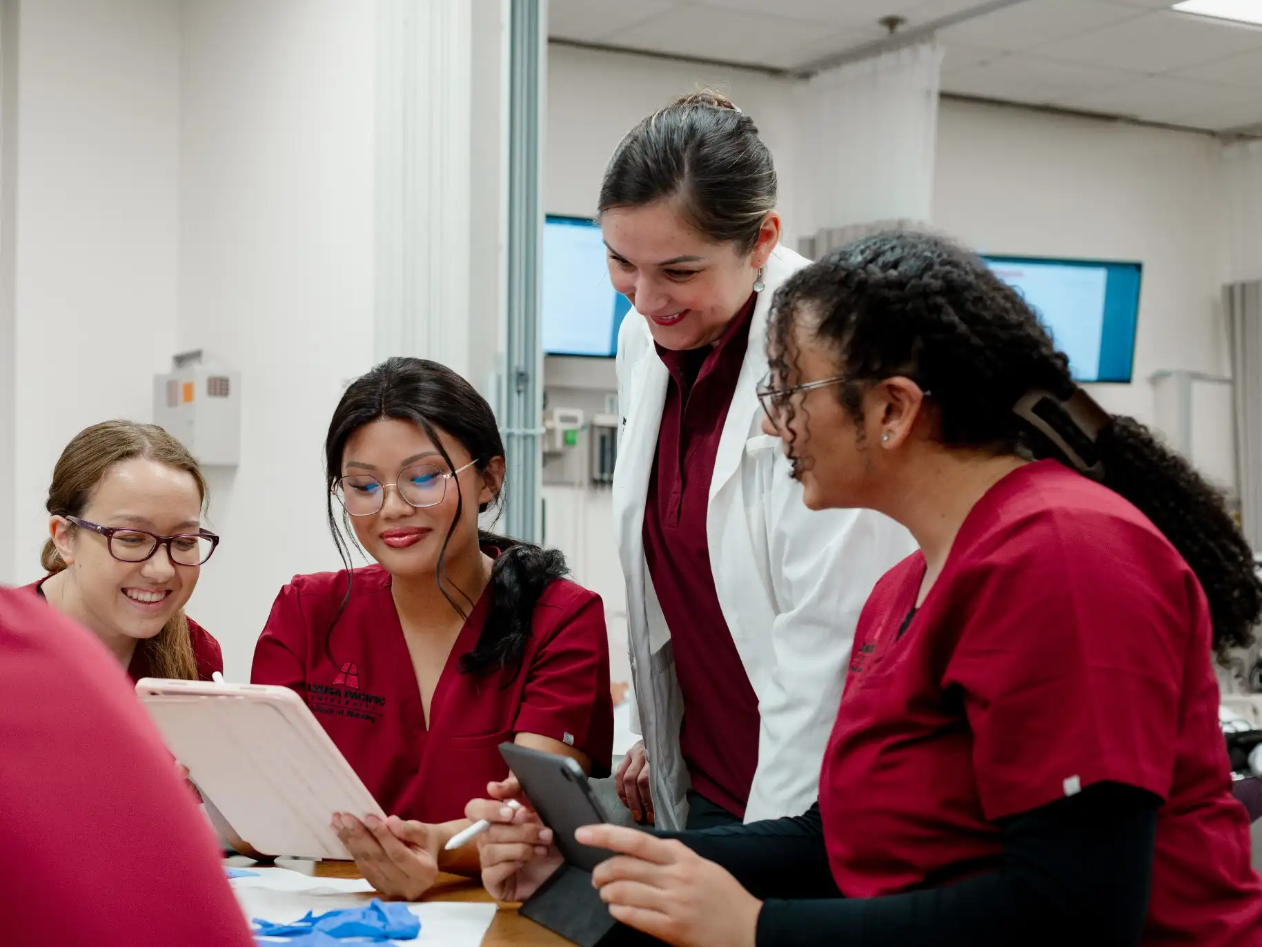APU nursing students look at data with their instructor