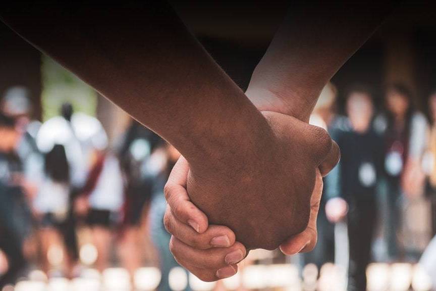 students holding hands