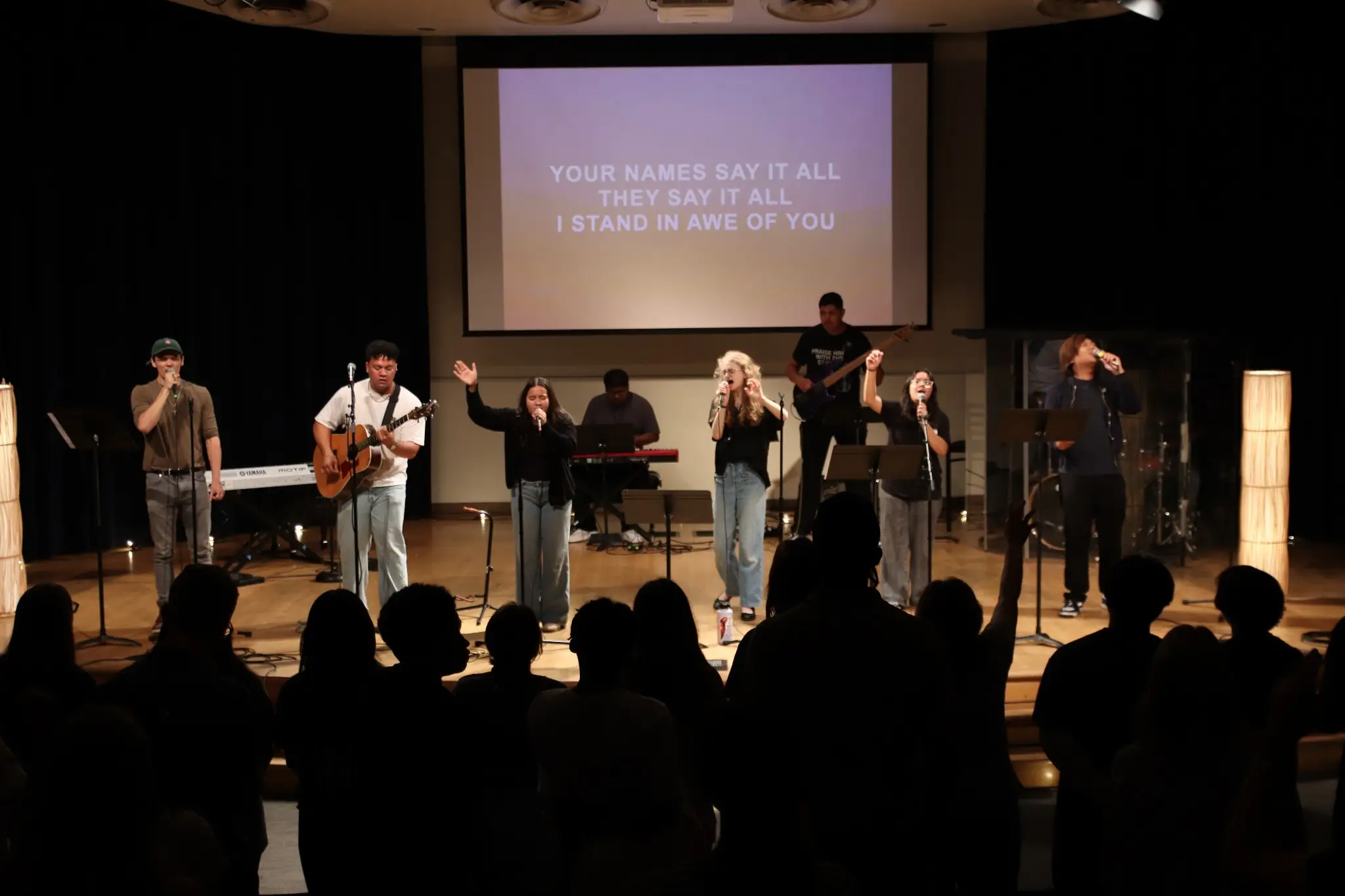 students singing on stage
