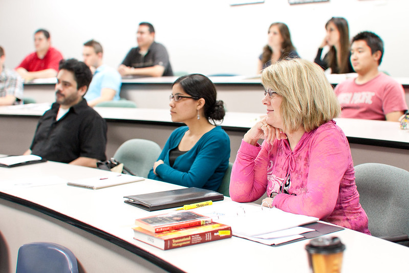 students paying attention to the professor in the classroom
