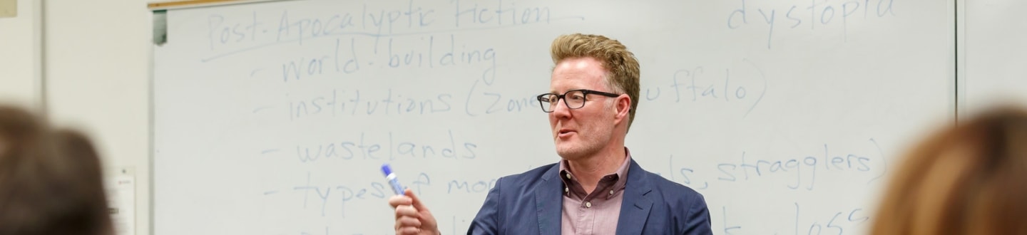 Teacher in front of whiteboard