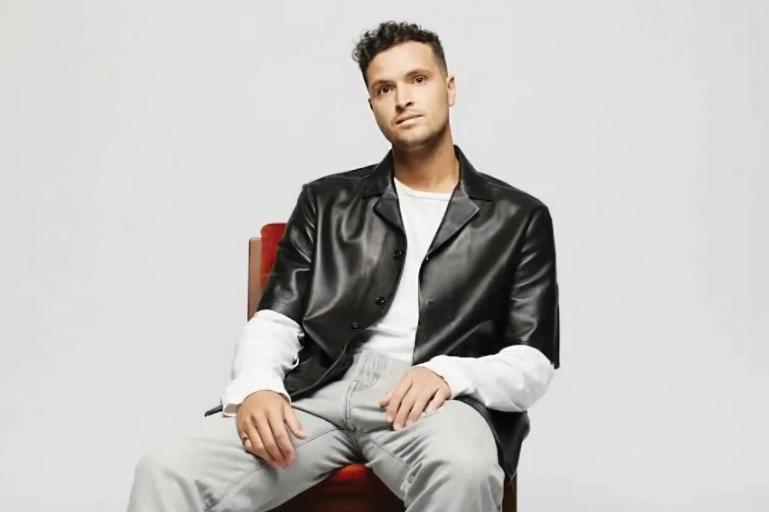 aodhan wearing a black jacket with a white backgorund