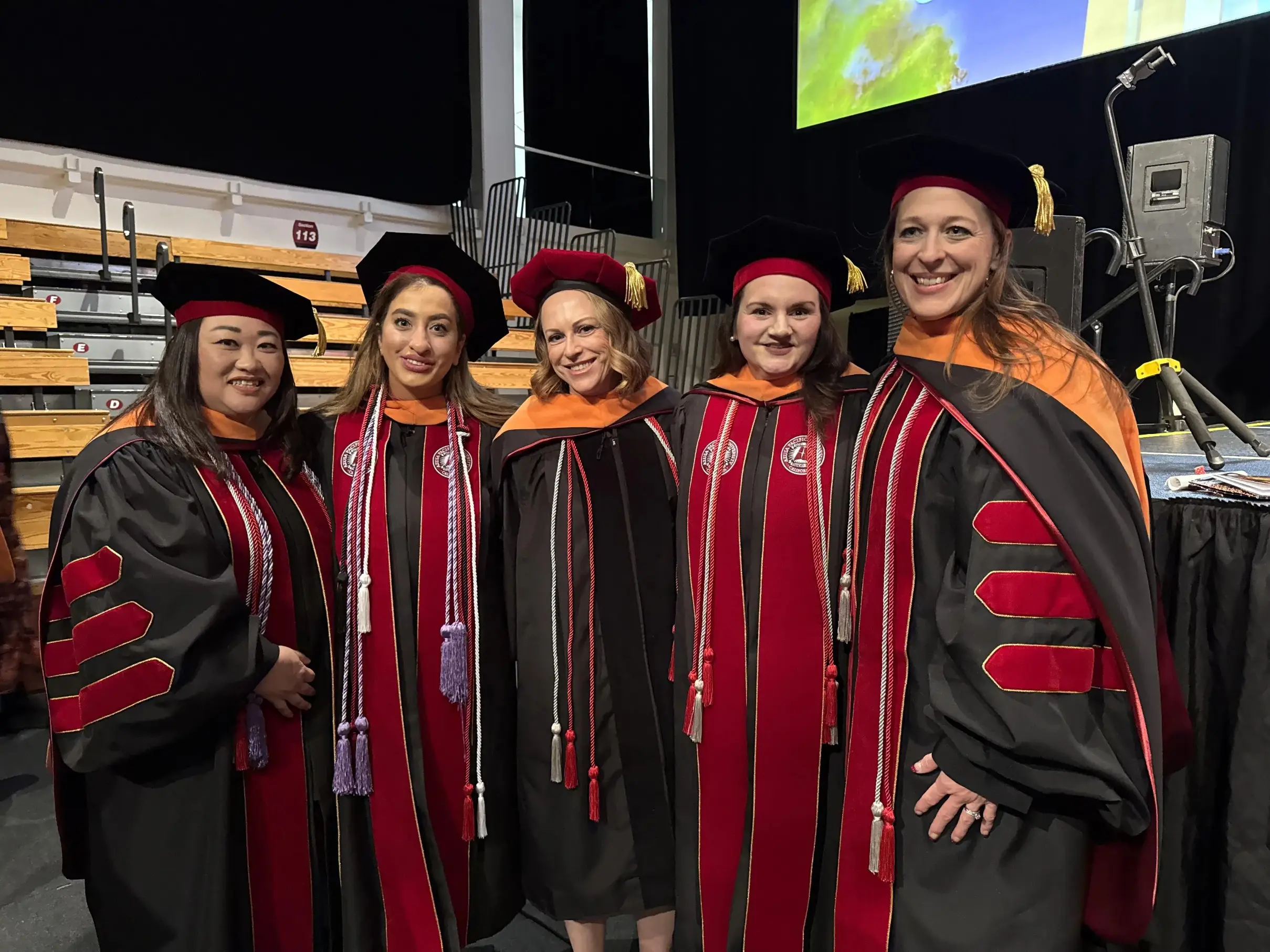 nursing students smiling at the picture with their uniforms