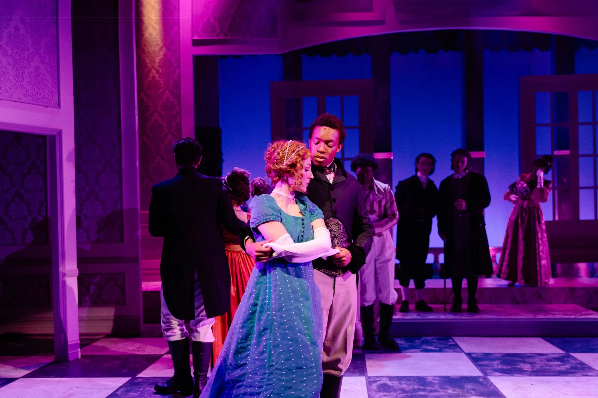 students acting during a class activity and being recorded with a camera