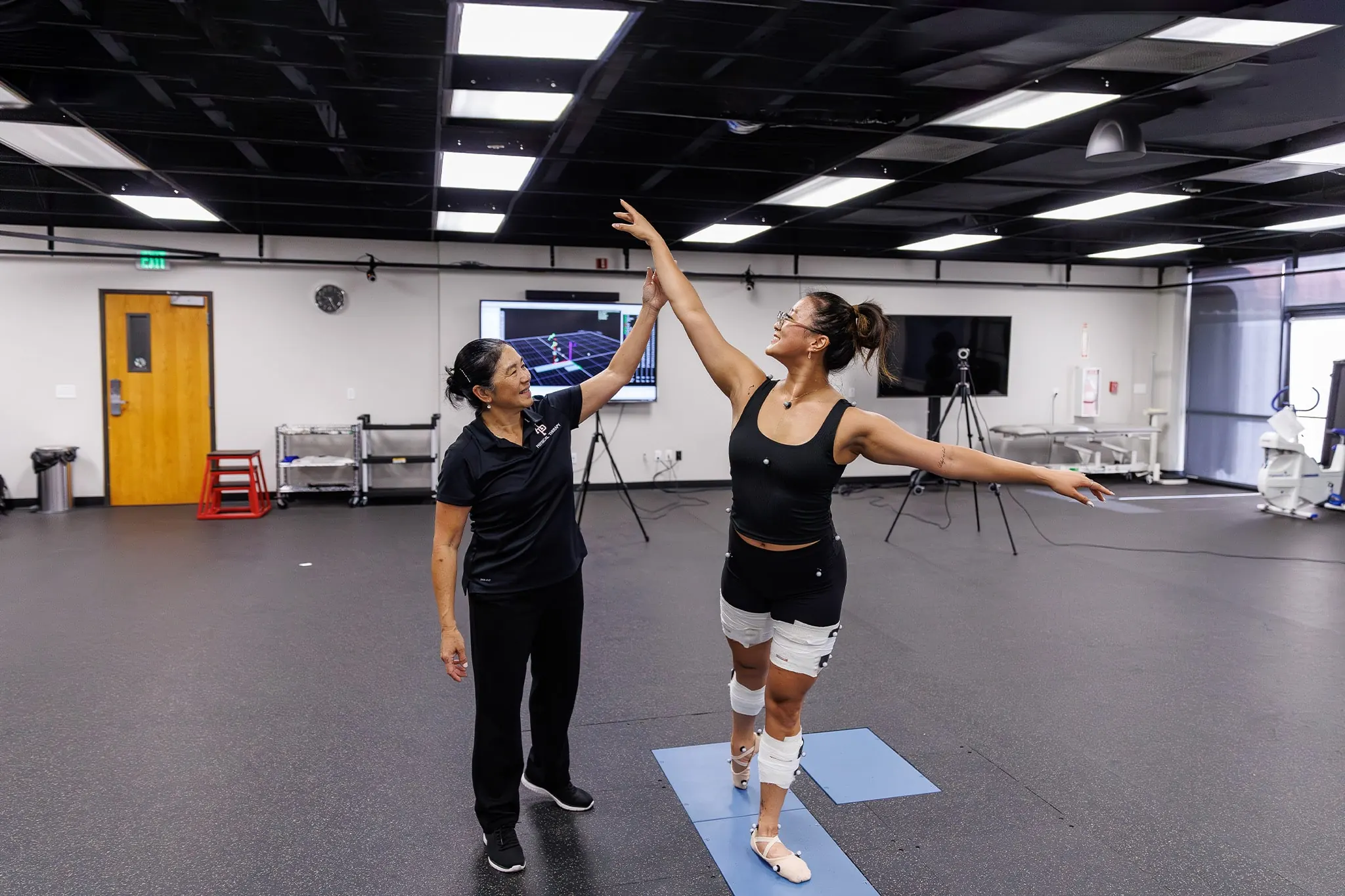 Students hanging out and smiling in West Campus