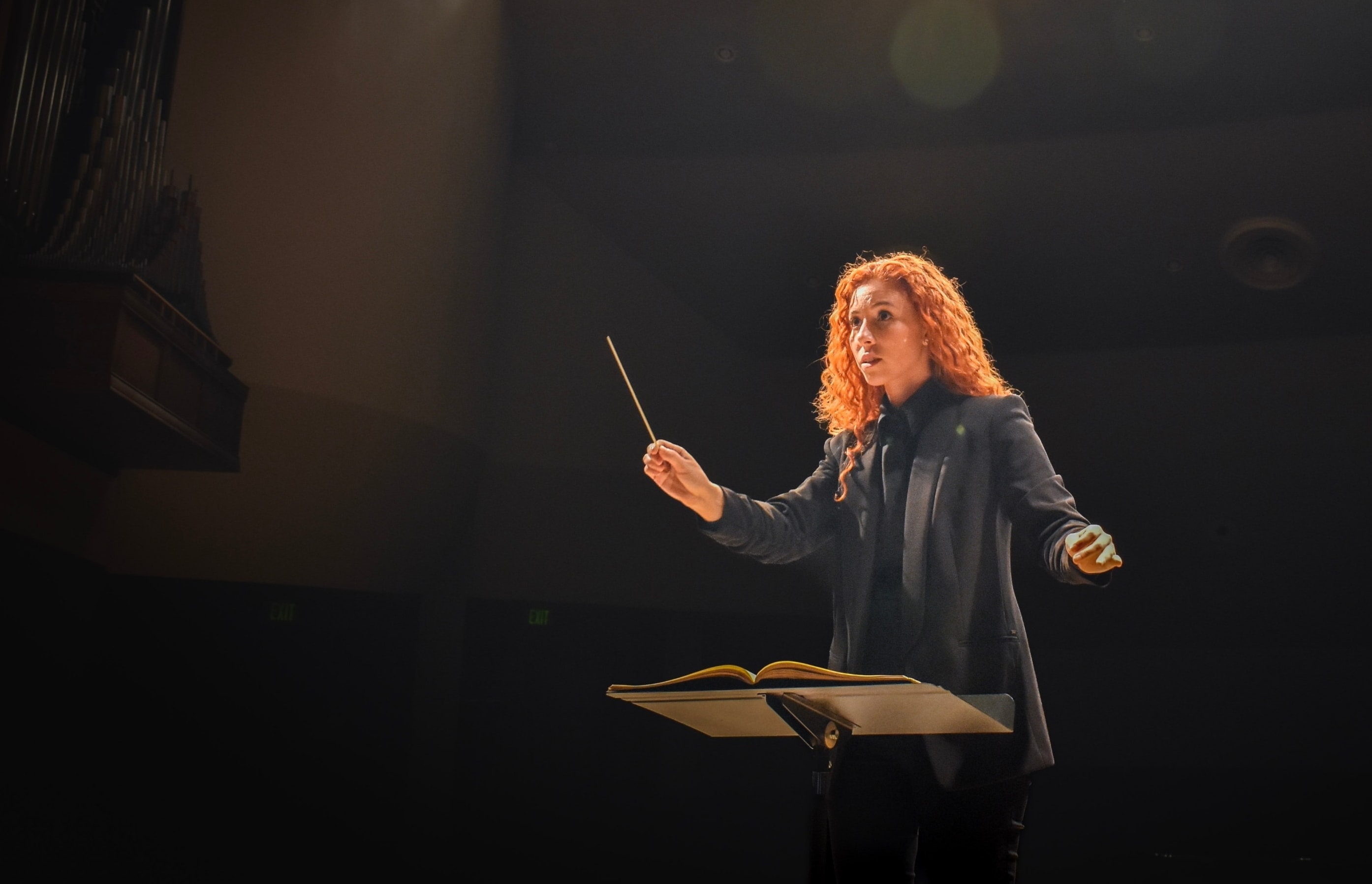 student conducting during orchestra