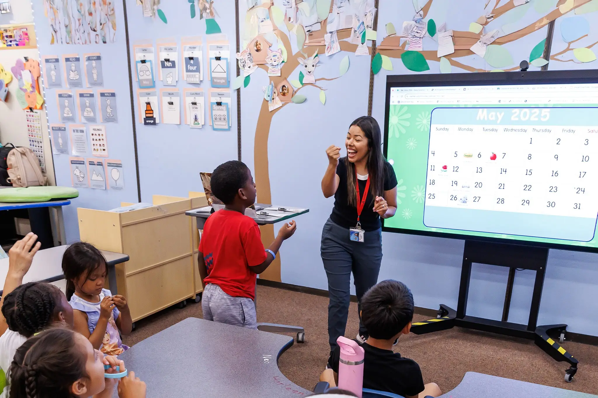 professor guiding students during a class activity
