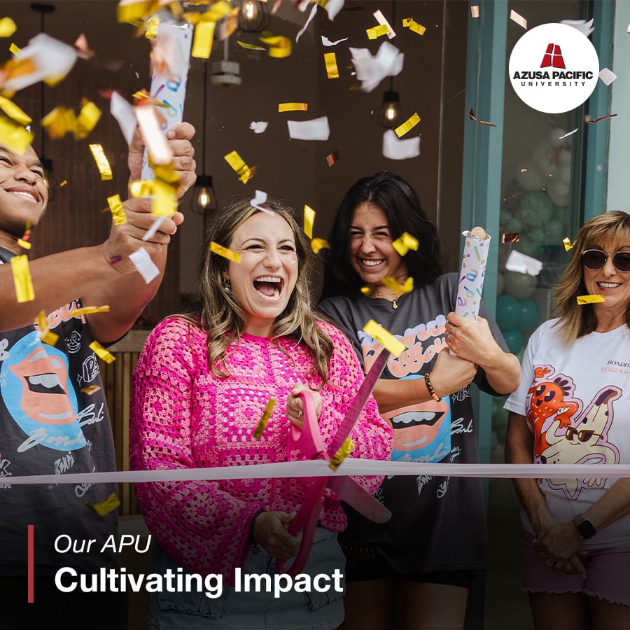 Bailey smiling with her friends during her store opening