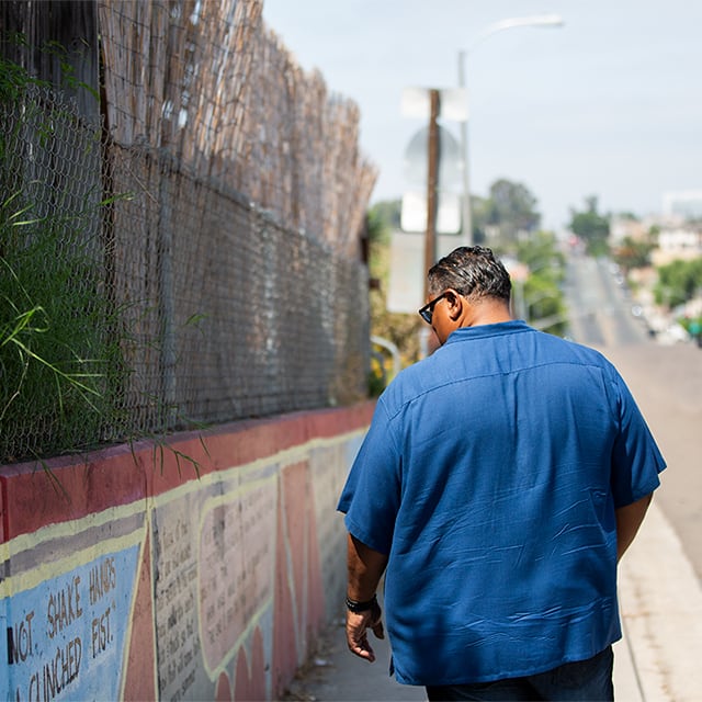 Rene walking down the street