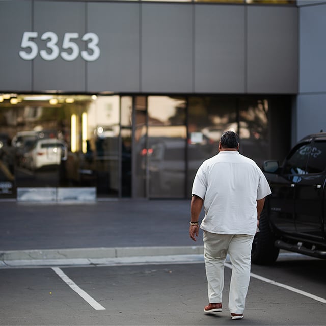 Rene in front of building
