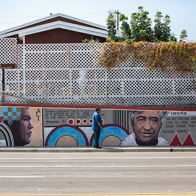 Rene walking on the sidewalk